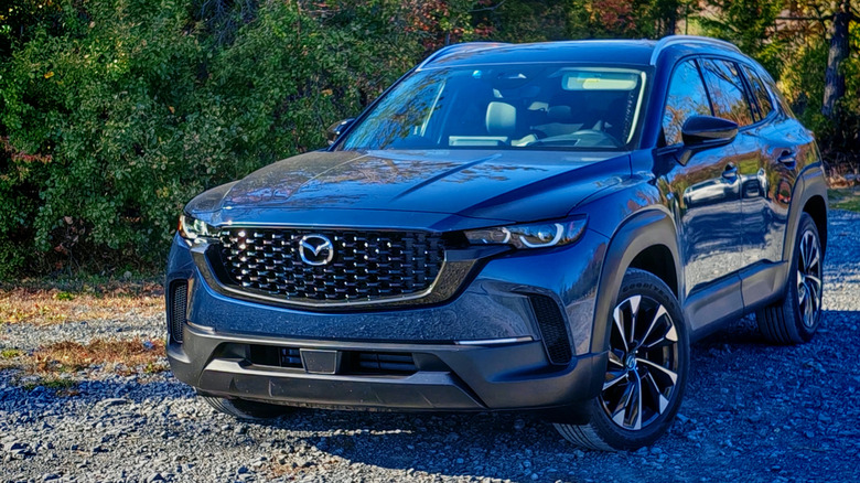 Rear 3/4 image of the 2025 Mazda CX-50 Hybrid