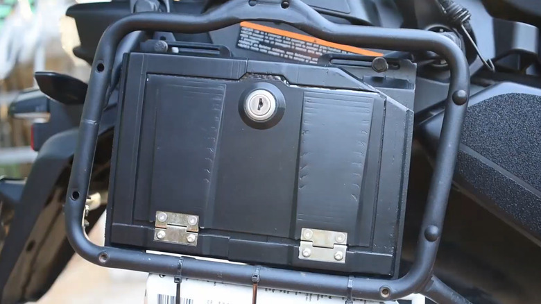 Emergency toolbox attached to carrier attachment