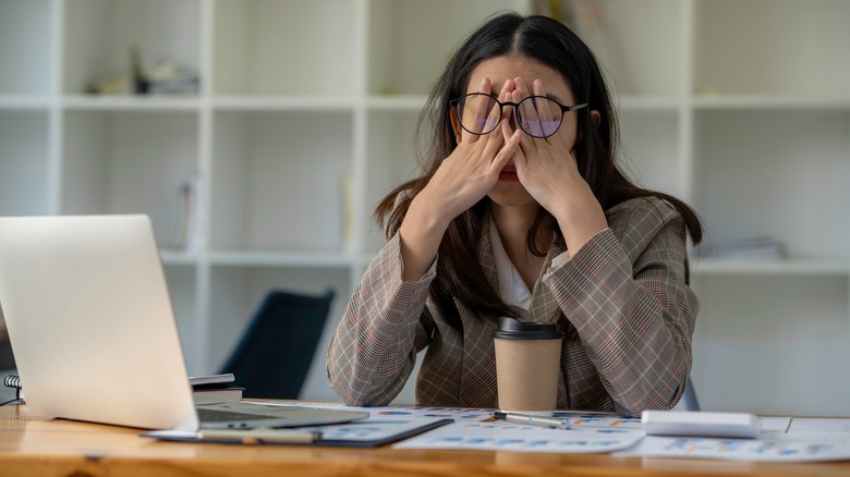 Woman exasperated with computer