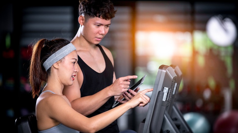 people talking on exercise bike