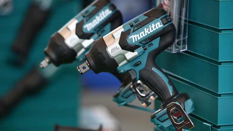 Makita drivers hanging up on wall