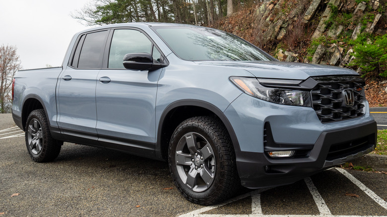 2024 Honda Ridgeline TrailSport parked next to mountainside