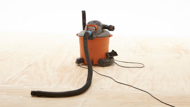 An orange shop vacuum