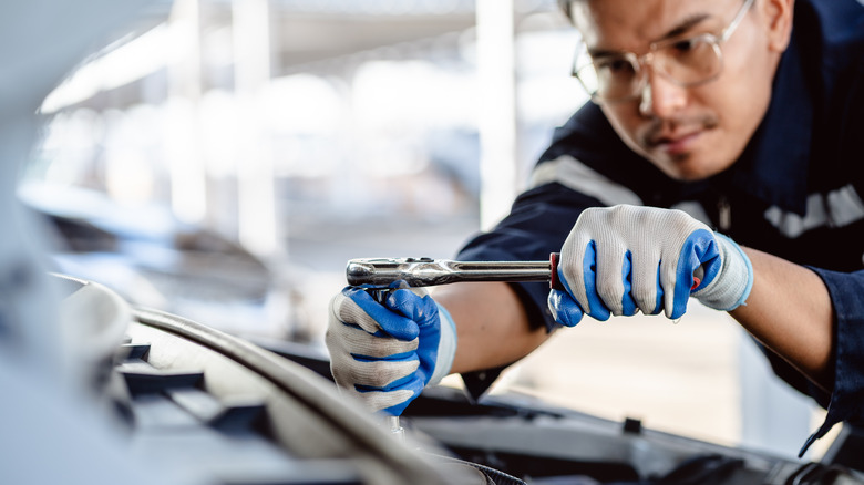 mechanic working on car