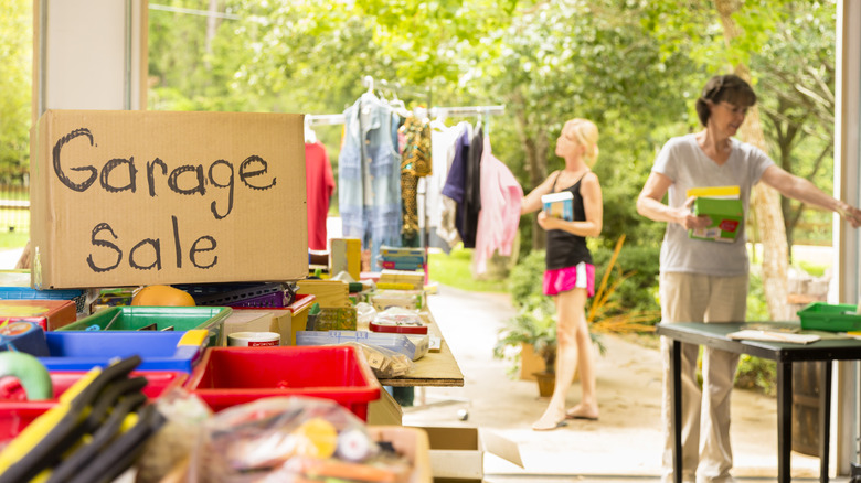 Bargain hunters browsing at a garage sale.