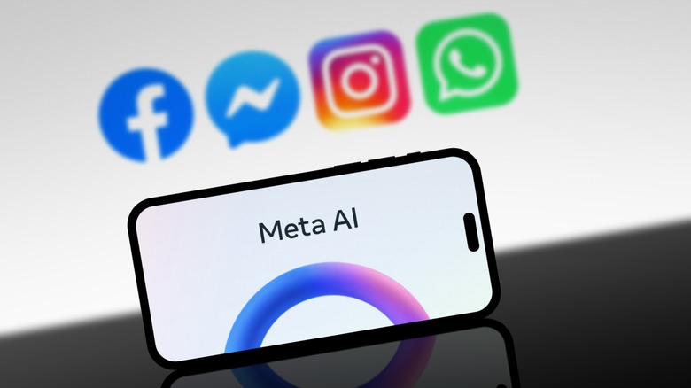 Meta app logos with Meta AI on a phone