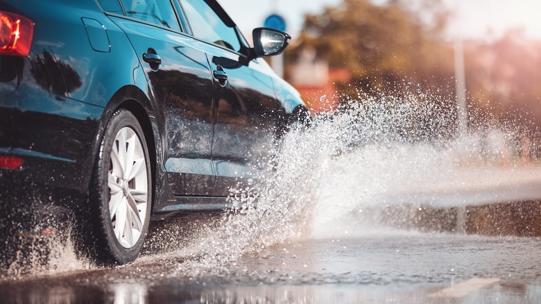 car tire in water puddle