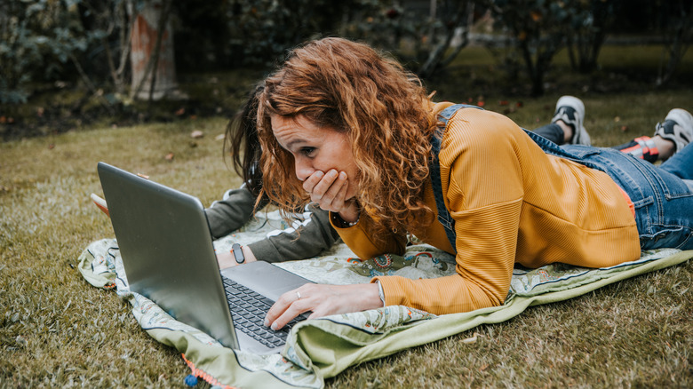 woman using computer outside