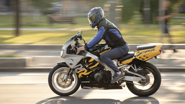 Man riding Honda motorcycle