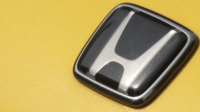 Honda emblem on yellow background