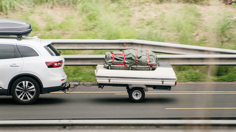 car pulling a small trailer