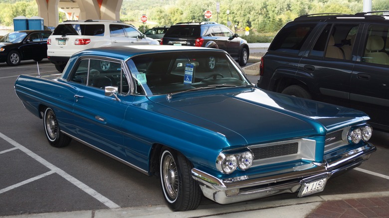 Blue 1962 Pontiac Grand Prix parked