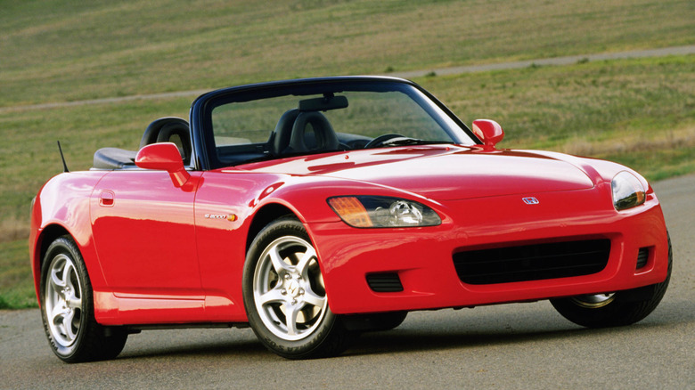 Red Honda S2000 during the day front 3/4 view