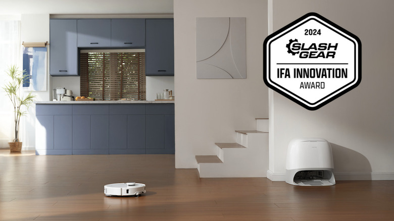 Qrevo Curv and dock in kitchen with Innovation Award badge