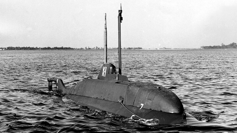 Black and white photo of X-1 midget submarine surfaced at sea