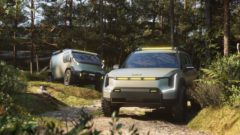 The Kia EV9 ADVNTR CONCEPT EV SUV and Kia PV5 WKNDR CONCEPT photographed inside a wooded area