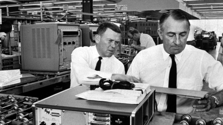 Hewlett Packard founders William Hewlett (Left) & David Packard (Right) with transistorized electronic counters in factory.