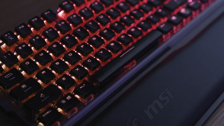 A light-up MSI mechanical keyboard on a table.