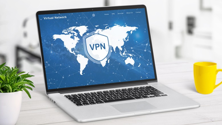 VPN web page service on laptop display displaying a world map with VPN locations. Highlights global network access, online security, and privacy protection