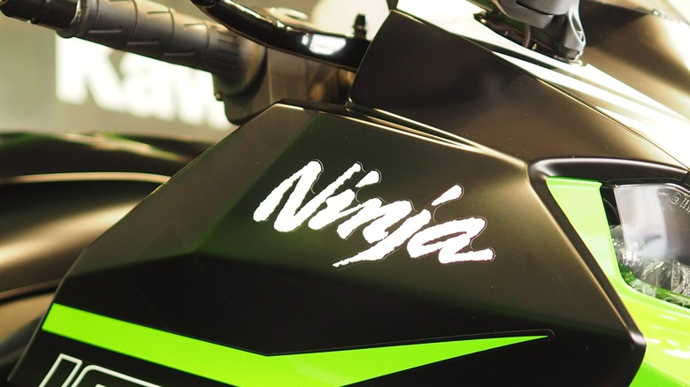 Close up of a Kawasaki Ninja logo on a motorcycle