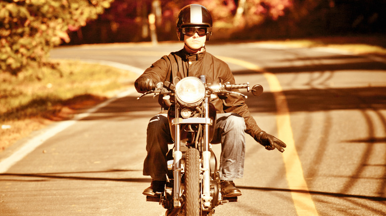 Biker gestures with two fingers