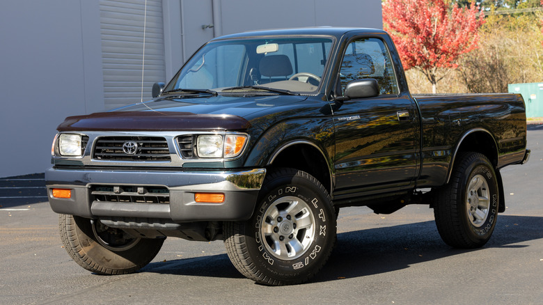 Black 1999 Toyota Tacoma in a parking lot