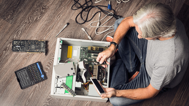 Man repairing or building a desktop computer