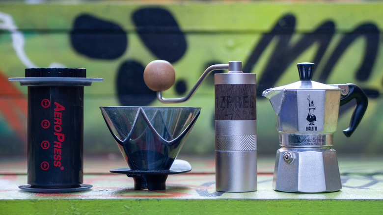 AeroPress, Hario V60 Mugen, 1Zpresso Q2 heptagonal and Bialetti Moka Pot photographed next to each other