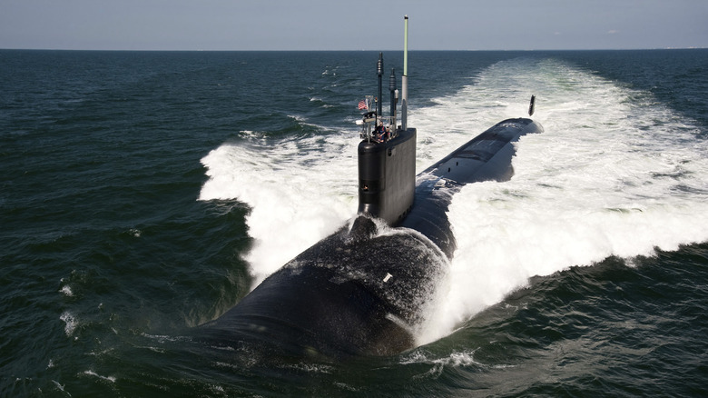 Military submarine on surface of the ocean