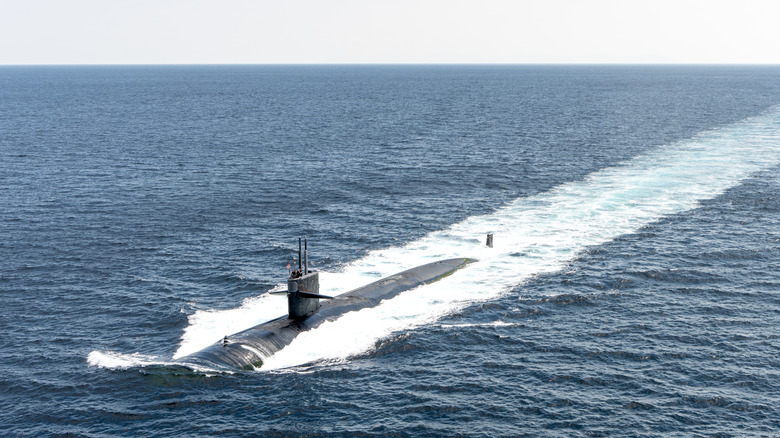 An attack submarine sails on the ocean's surface