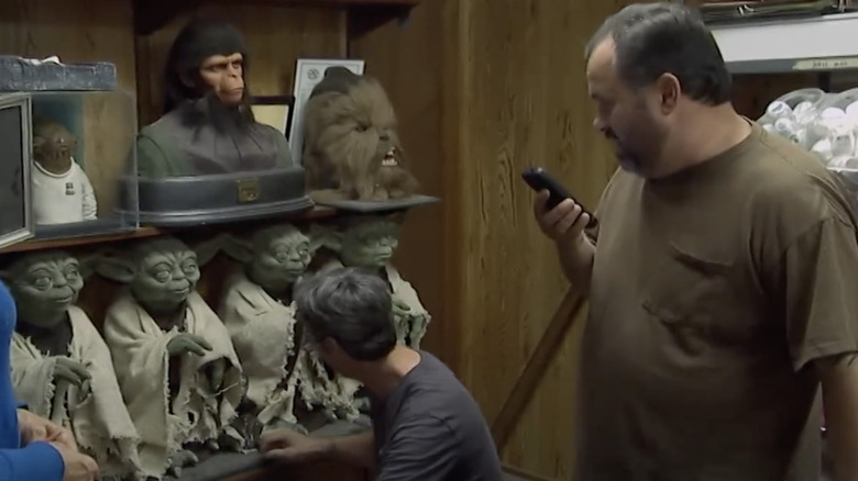 Mike Wolfe and Frank Fritz in movie memorabilia shop with Yoda figures on shelf