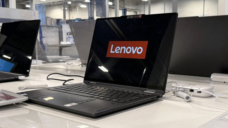 line-up of Lenovo laptops in a store