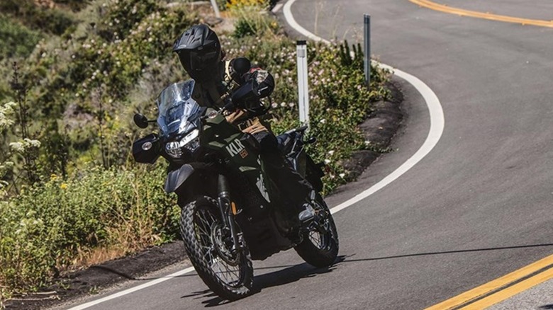 A Kawasaki KLR 650 carving a mountain road.