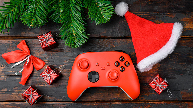 Xbox controller next to tiny stocking stuffer sized presents