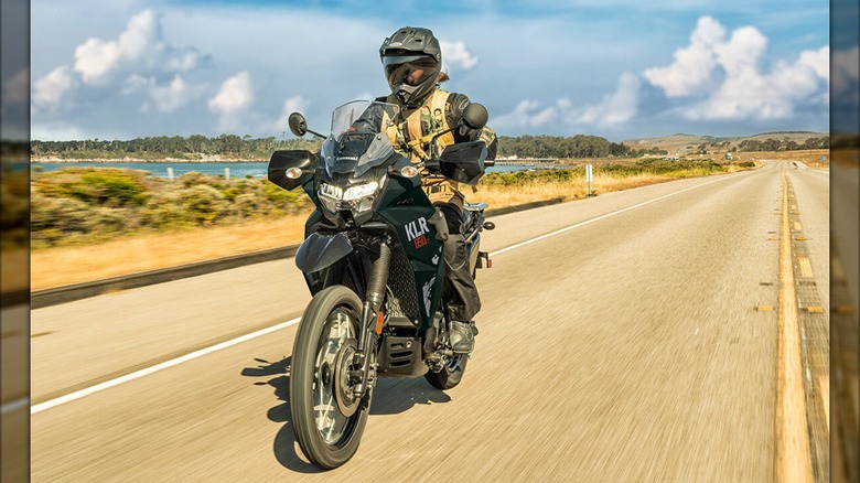 Riding the Kawasaki KLR 650 on the highway.