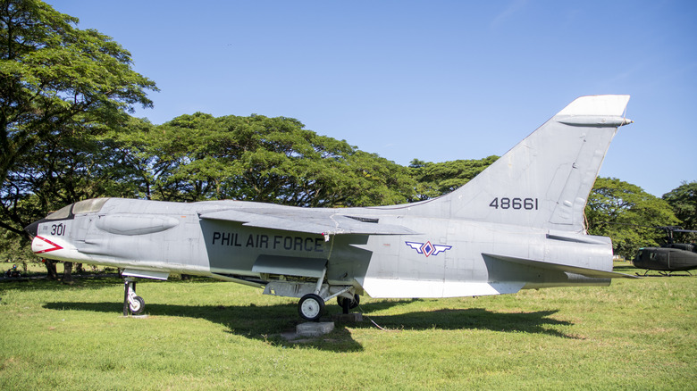 A Vought Crusader model on display on a grassy field