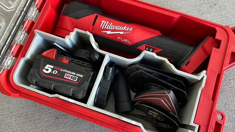 Milwaukee power tool, battery, and accessories stored inside an organizer