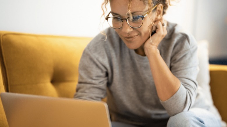 Person shopping on laptop