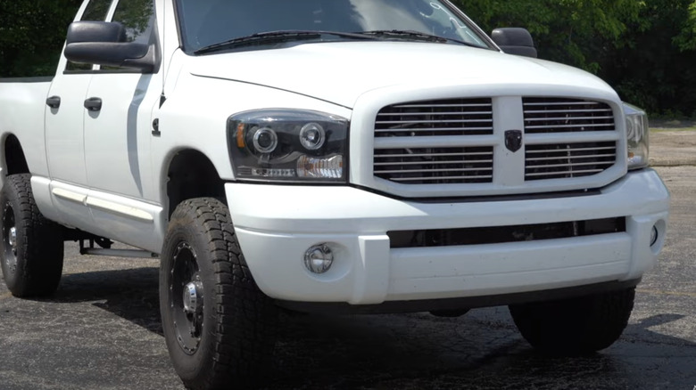 white Ram diesel pickup truck with 5.9L Cummins viewed from front right